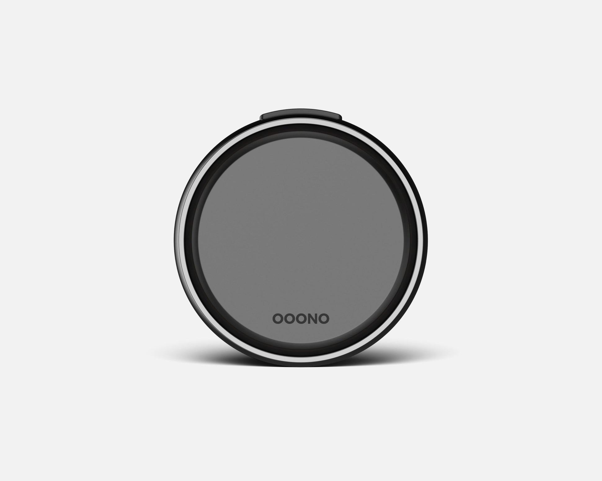 A round, black and gray CO-DRIVER NO2 PLUS device with a smooth surface and the OOONO logo at the bottom center, photographed against a plain white background.