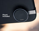 Round black trafikalarm (speed camera detector) mounted on textured black surface, with "Mount included" text visible.