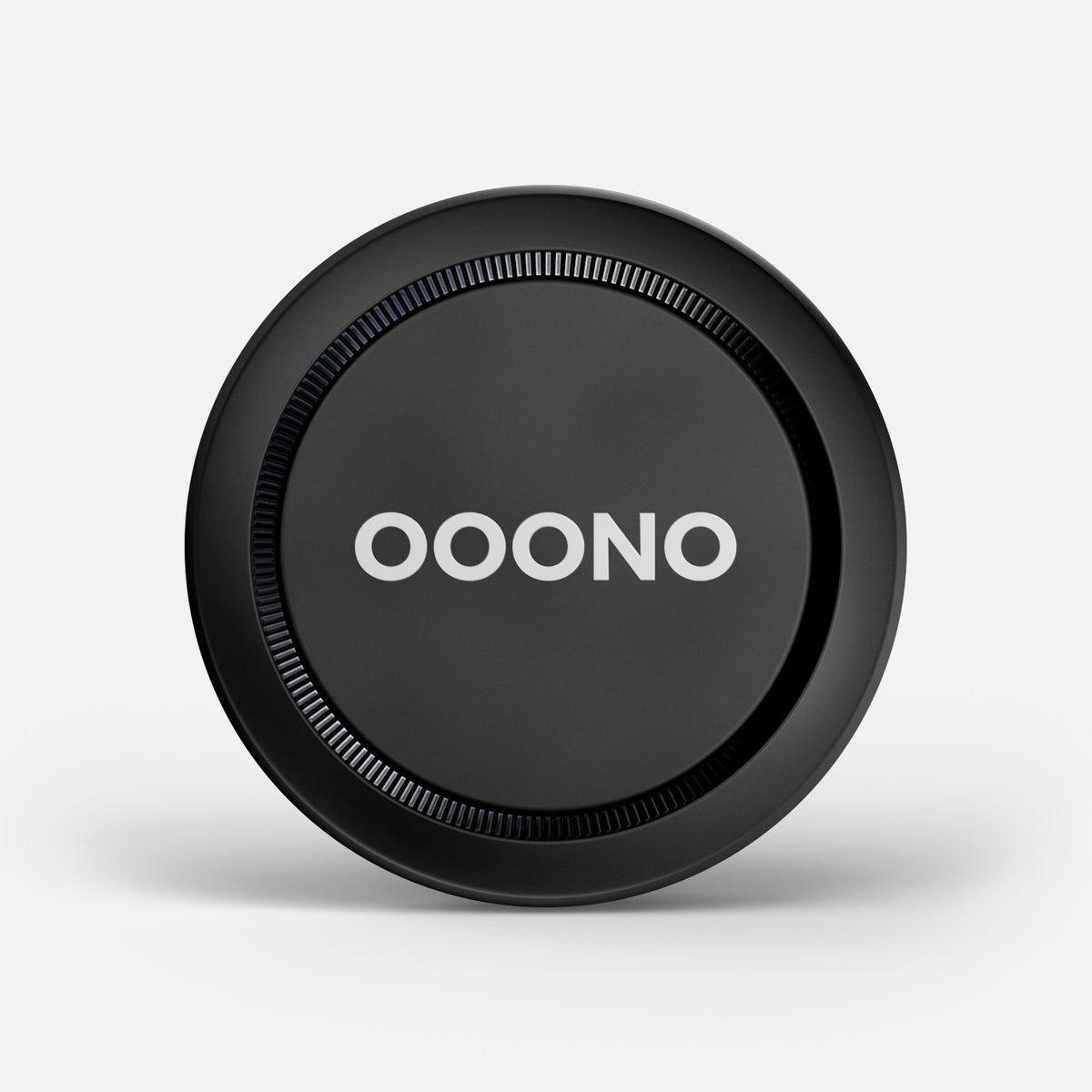 The CO-DRIVER NO1 is a black circular device featuring 'OOONO' in bold white letters at its center, designed to keep you informed about road hazards and live traffic, displayed on a plain light background.