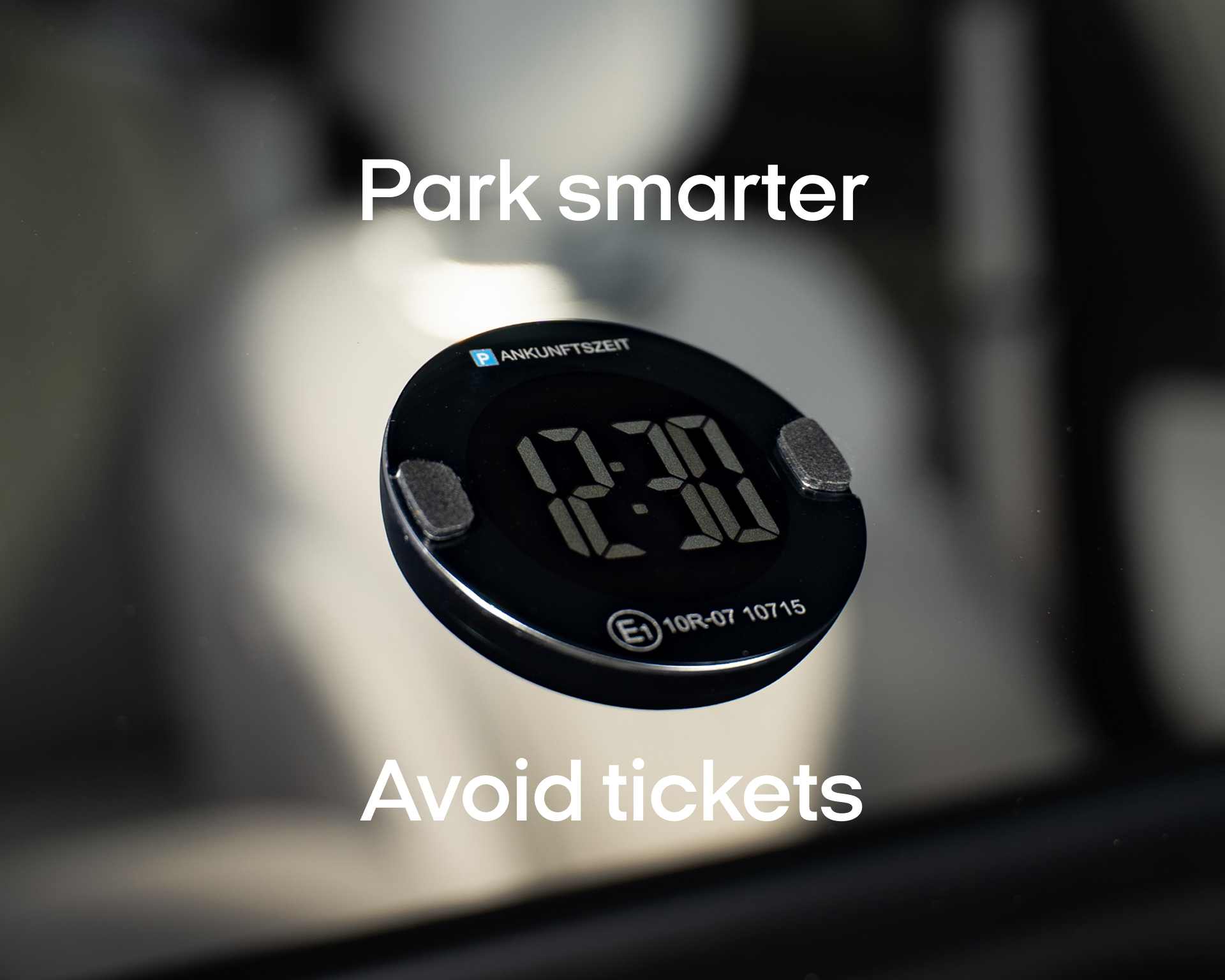 Digital parking timer and Blitzerwarner on a car window shows 2:30 and the message "Park smarter. Avoid tickets.