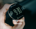 Hand holding a round digital clock at 9:30, labeled "speed camera detector" (trafikalarm) with Magnetic Mounts below.