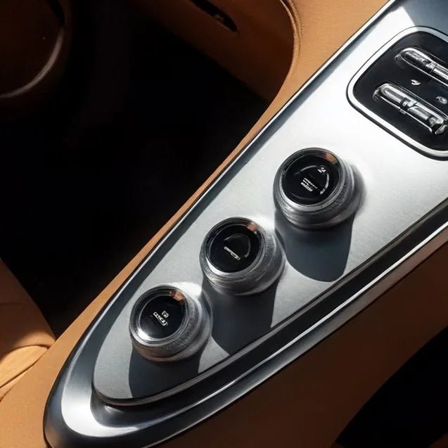 Close-up of the control buttons on a car's centre console