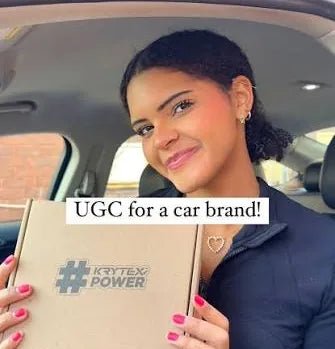 Driver smiling in her car with an unboxed parcel
